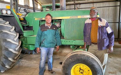 Clifford Mthimkulu with his father Koos on their farm in South Africa. Photo: Chris McCullough