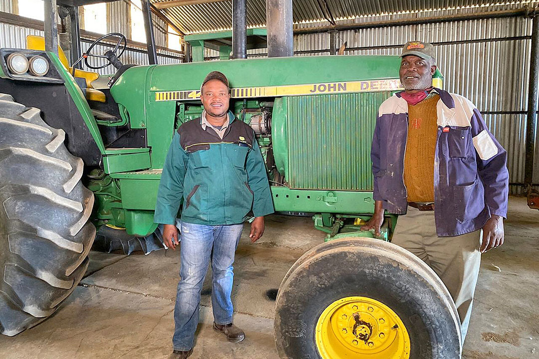 Clifford Mthimkulu with his father Koos on their farm in South Africa. Photo: Chris McCullough