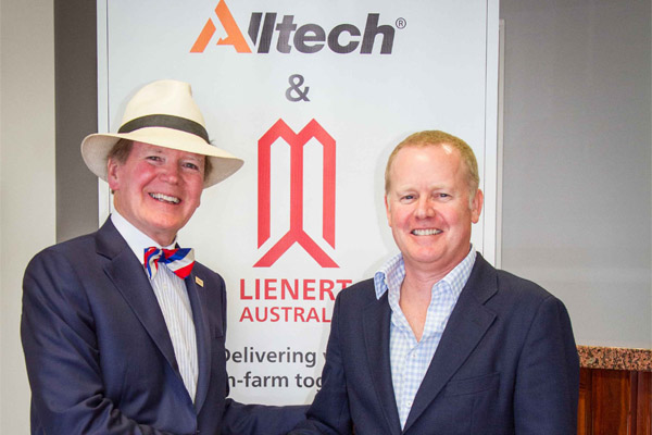 Alltech founder and president Dr Pearse Lyons shakes hands with Nick Lienert, managing director Lienert Australia after finalizing the agreement to purchase 100% of the shares in Lienert Australia.