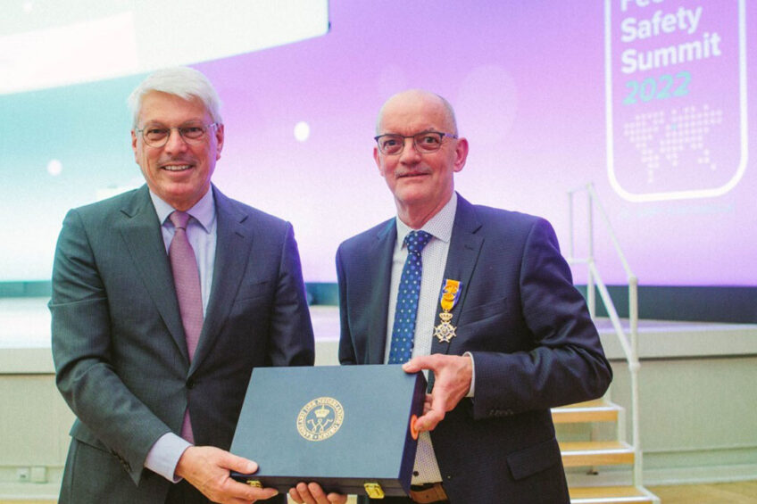 At the Global Feed Safety Summit in Berlin, Germany, Peter Vermeij, Agricultural Counsellor of the Dutch Embassy, presented GMP+ International’s founder, Johan den Hartog, with the honour of Officer of the Order of Orange Nassau. Photo: GMP+ International