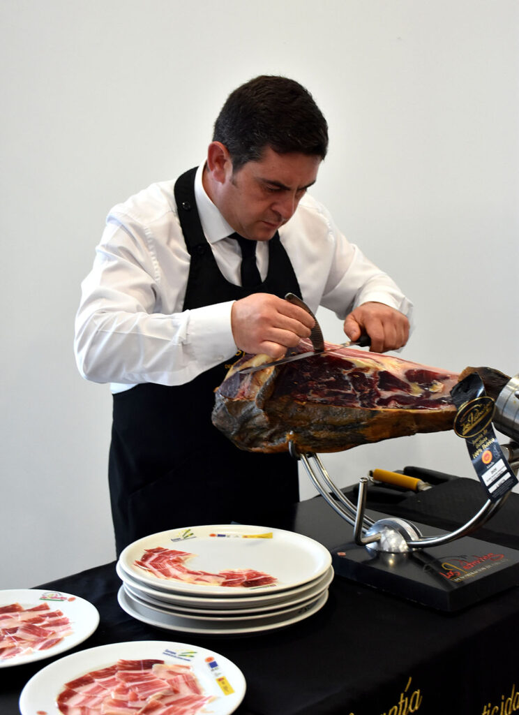 According to official master carver Juan Angel Pulido, it takes a lot of skill to professionally carve the hams. Photo: Chris McCullough